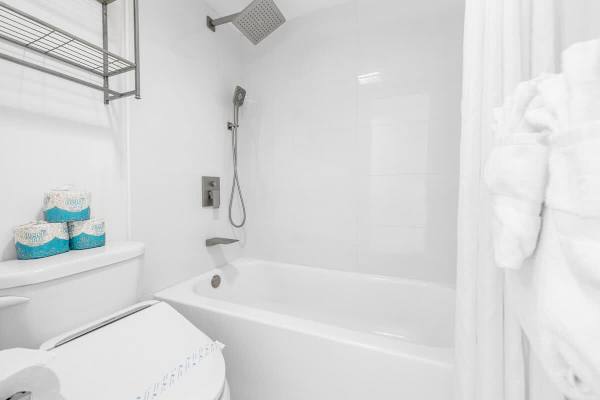 Newly renovated bathroom with tub and shower combination