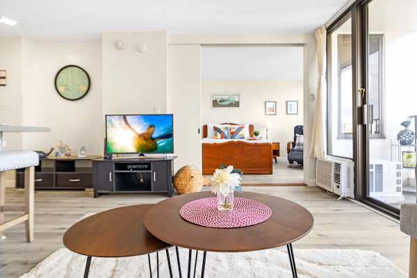 Living room with cable TV. Window AC