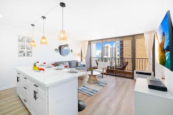 The living area has a pull-out sleeper sofa, 1 chair, coffee table, flat screen TV, and a window AC.