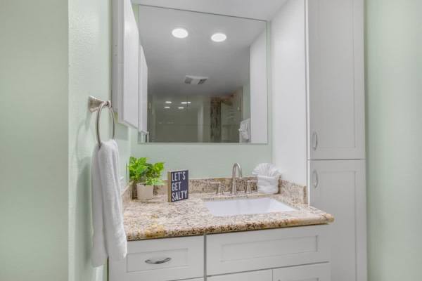 Bathroom with vanity and cabinet