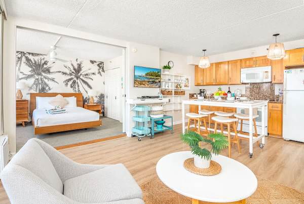 Enjoy watching your favorite TV shows, and movies in your living room with a flatscreen TV, comfortable armchair, and coffee table.
