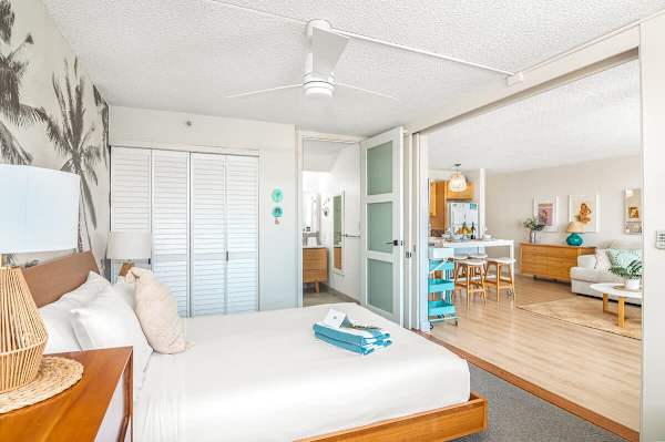 The bedroom has a sliding door that separates from the living room for privacy.