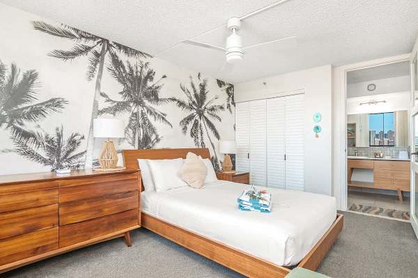 Your bedroom features a queen-size bed, cabinet, and access to the bathroom.
