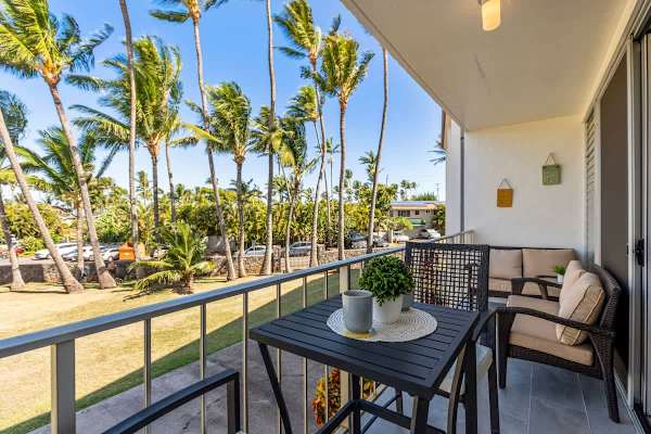 Start your day with a cup of coffee on the private balcony, surrounded by lush palm trees and a gentle tropical breeze.