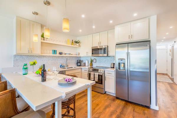 Create your favorite meals in this modern and well-appointed kitchen, featuring stainless steel appliances and a convenient breakfast bar.