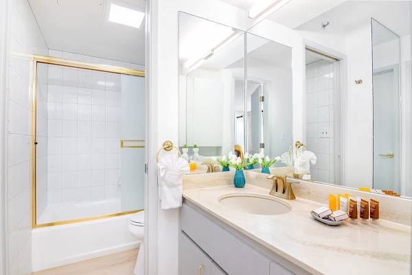 Full bathroom with tub and shower combo, and a vanity with a cabinet.