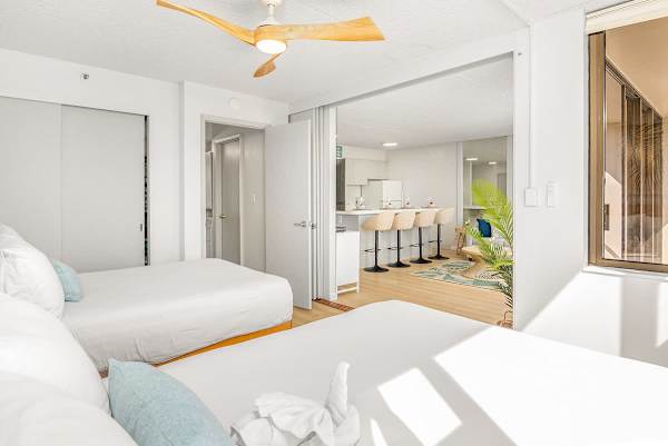 Bedroom with a sliding door that separates from the living room for privacy.