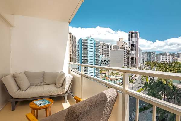 Spacious balcony with comfortable sofa.