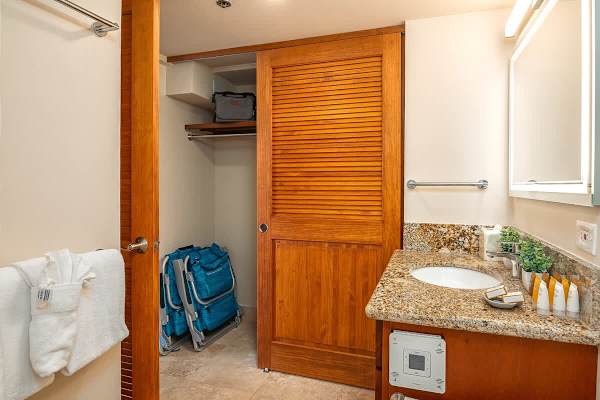 Bathroom with closet and beach chairs.