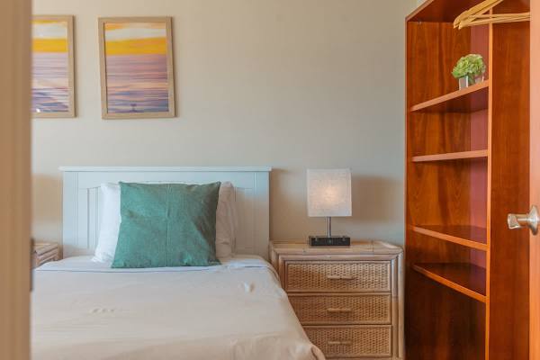 The second bedroom with nightstand.
