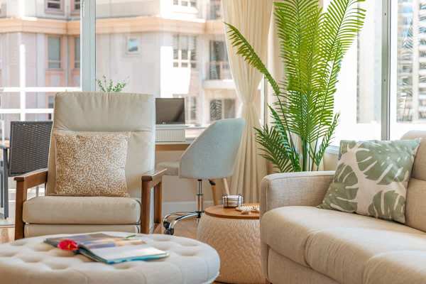 Pull-out sleeper sofa, coffee table, and chair in the living room.