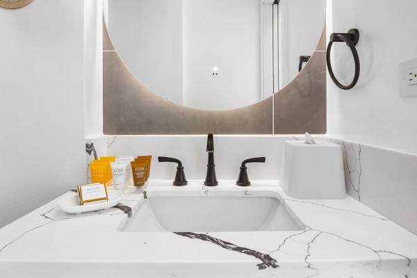 Full bathroom with vanity and cabinet.