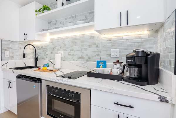 Cook delicious meals in your kitchen with a 2-burner cooktop and mini fridge.