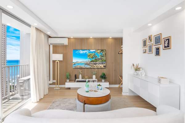 A very comfortable living space with a 65'' Samsung Smart TV, lounge sofa, and lift-top round coffee table.