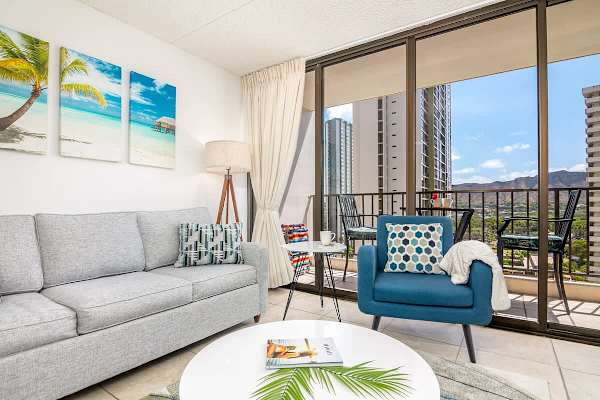 Spacious living room with pull-out sleeper sofa, coffee table, and chair.