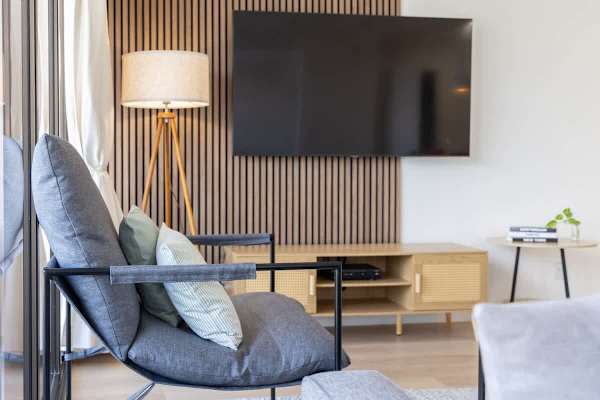 Relax in a modern living space that's perfect for enjoying an immersive movie night.