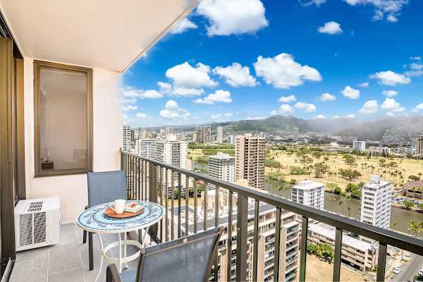 Start your day with a cup of coffee on your private balcony while enjoying stunning panoramic views of the city skyline and mountains.