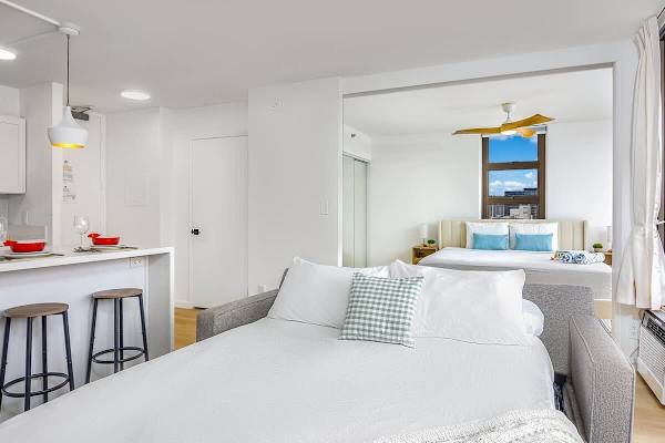 A stylish retreat that accommodates family and friends with a pull-out sofa in the living area and a separate, private bedroom.
