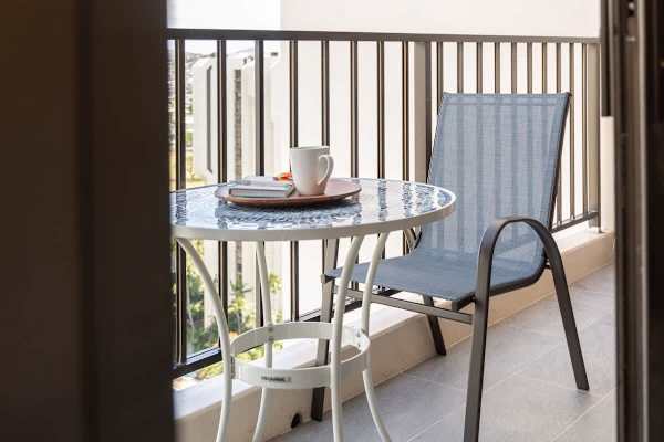 From your balcony, enjoy the panoramic mountain and city views while drinking your cup of coffee.