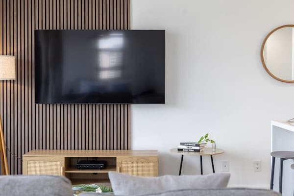 Relax in a modern living space that's perfect for enjoying an immersive movie night.