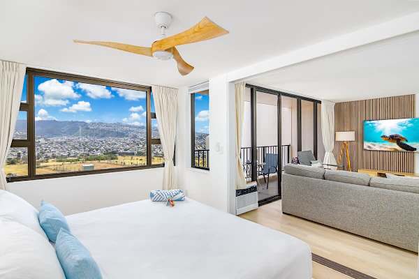Relax in your spacious king-sized bed, privately separated from the living area by a sliding door, all while enjoying stunning island views.