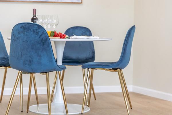 Dining table with 4 chairs for shared meals.