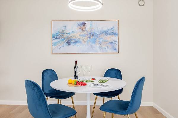 Dining table with 4 chairs for shared meals.