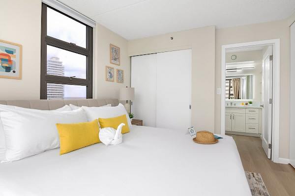 Relax in your bedroom with a king-size bed, a closet, and access to the bathroom.