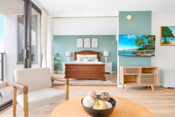 Enjoy watching your spending time with your loved ones in your living area with a pull-out sleeper sofa, coffee table, armchair, and a 50'' Smart TV.