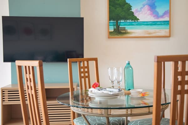 Dining table with 4 chairs for shared meals.
