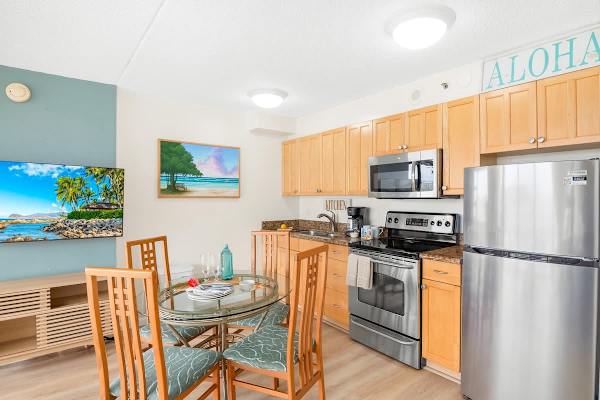 Cook delicious meals in your fully equipped kitchen with full-size appliances, and share them with loved ones at your dining table with 4 chairs.