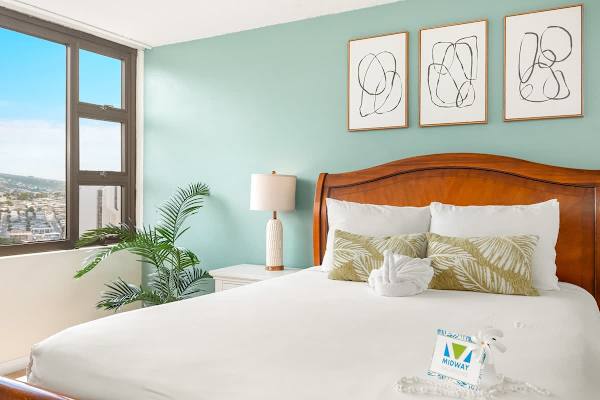 Bedroom with beautiful mountain and city views.