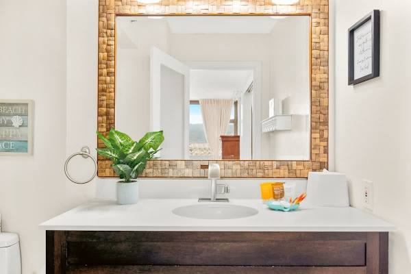 Full bathroom with vanity and a cabinet.