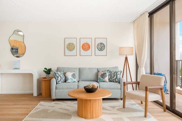 Living area with pull-out sleeper sofa, a coffee table, and an armchair.