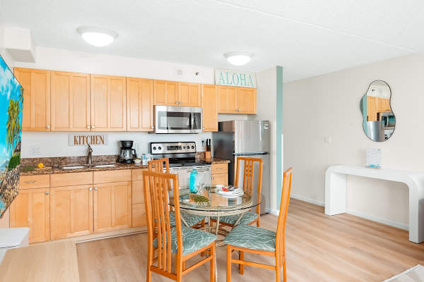 Cook delicious meals in your fully equipped kitchen with full-size appliances, and share them with loved ones at your dining table with 4 chairs.