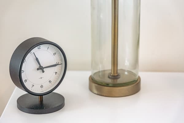 Bedside lamp and clock in you master bedroom
