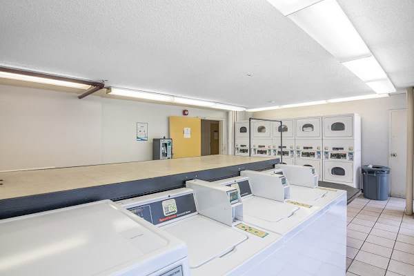Credit card and coin-operated laundry area.