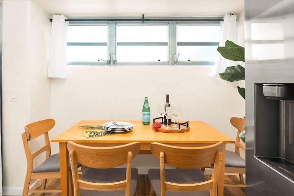 Dining area with table and 4 chairs perfect for shared meals.