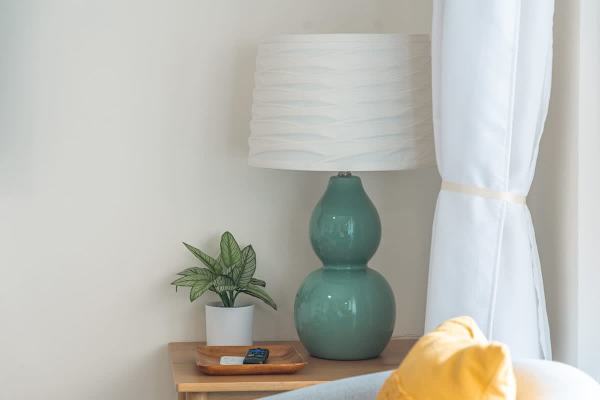 Powder blue glass lamp in the living area.