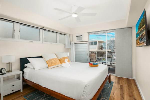 Relax in the master bedroom with a king-size bed, AC, 43'' smart TV, and a private lanai.