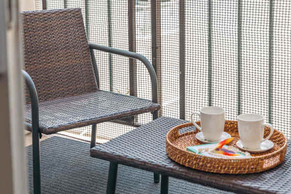 Enjoy morning coffee or evening cocktails on your balcony.