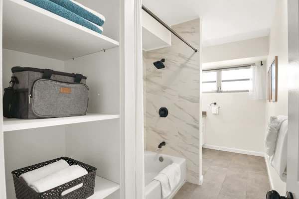 Master bedroom's bathroom with tub and shower combo.