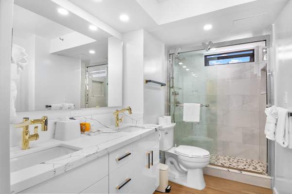 Refreshed in your full bathroom with walk-in shower, and a vanity with a cabinet.