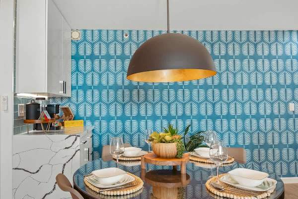 Dining area with table and 4 chairs, and retro pendant lampshade