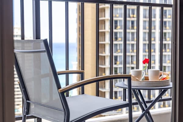 Table and 2 chairs on your balcony.
