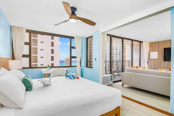 Relax in your bedroom with a king-size bed, ceiling fan, and sliding door for your privacy.