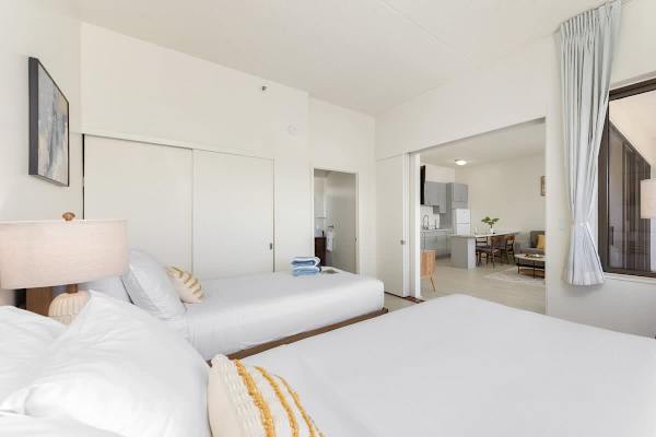 The bedroom is separated from the living room by a sliding door