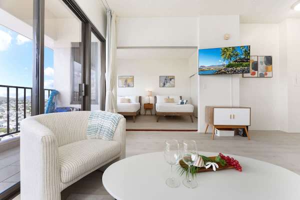Living room with 50" Smart TV, coffee table, accent chair