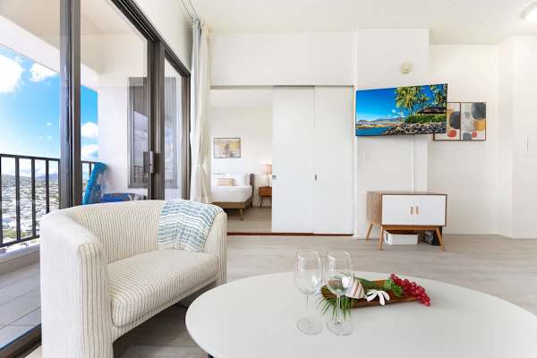Living room with 50" Smart TV, coffee table, accent chair