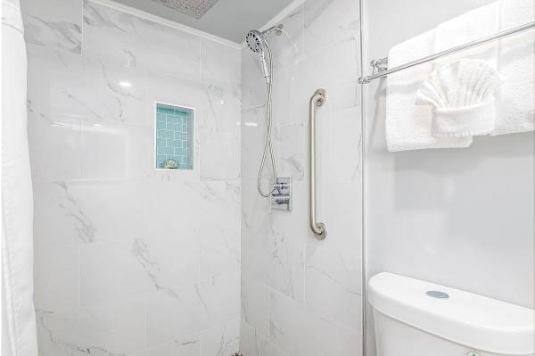 The minimalist bathroom shower area.